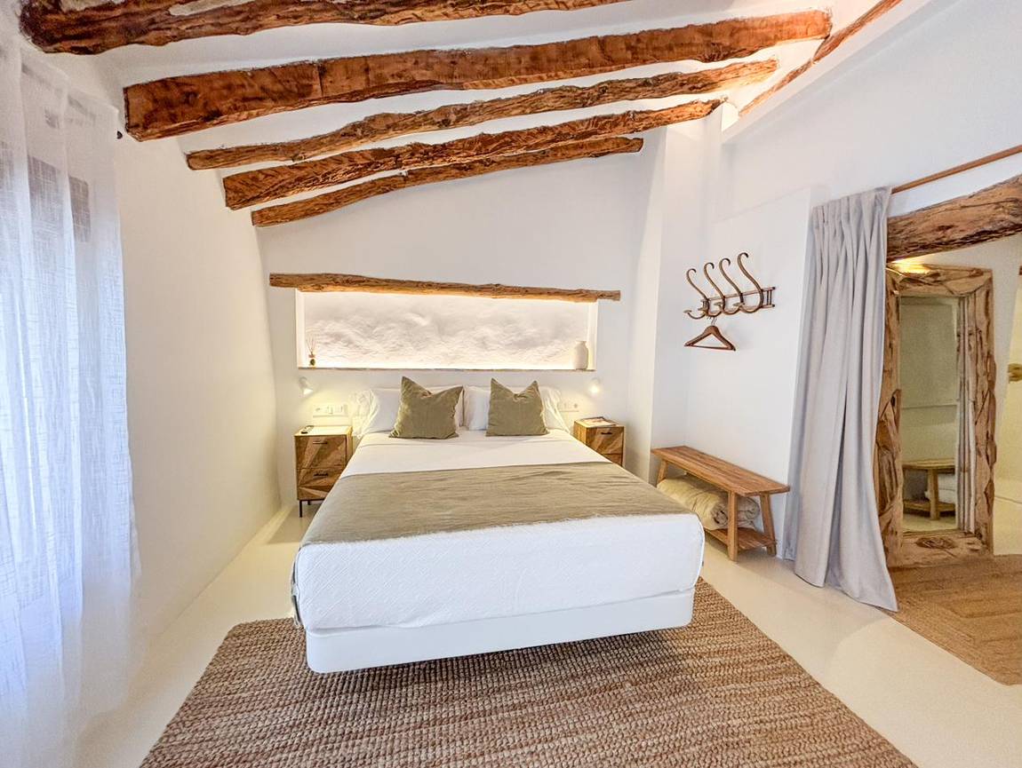 Dormitorio principal · la cama
