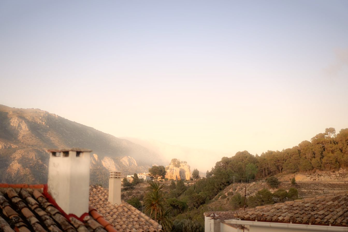 From the roof terrace: the rooftops of Benimantell and the mountains beyond.